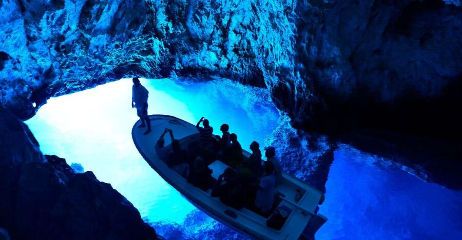 From Hvar: Blue and Green Cave Day Tour - Where you start in Hvar, and what the speedboat ride feels like