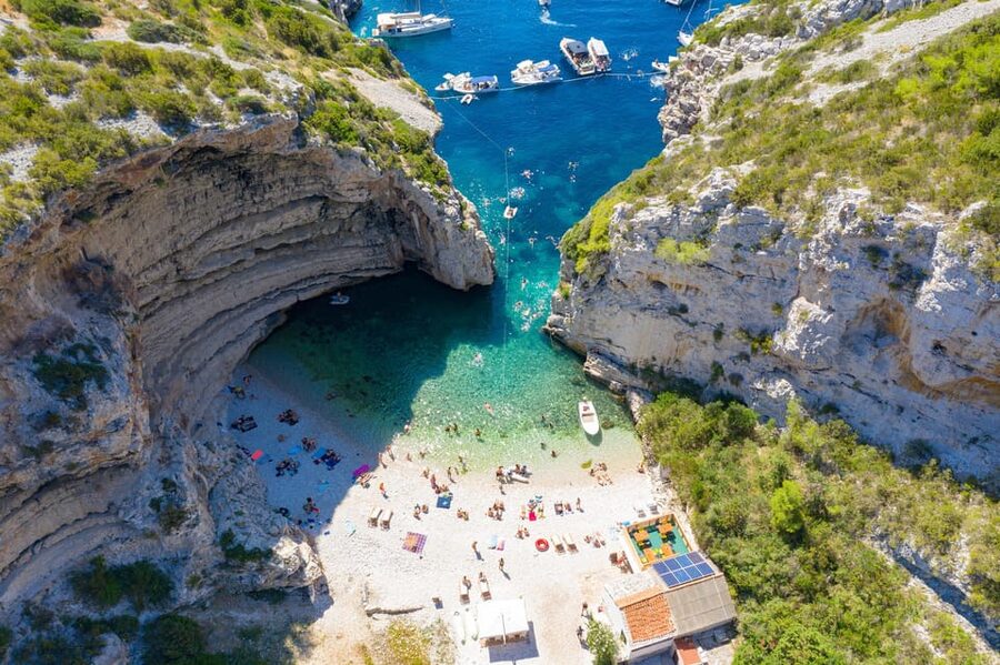 From Hvar: Blue cave group speedboat tour full day - Stiniva Cove: swimming in where boats cannot