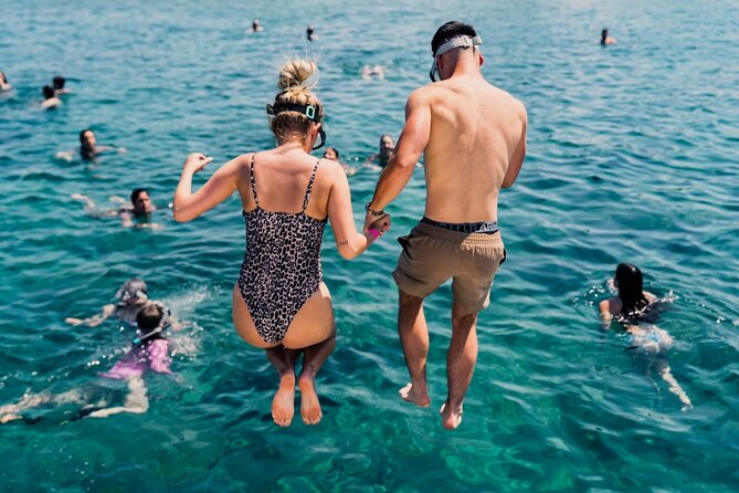 From Split: Blue Lagoon and 3 Islands Speedboat Tour - Stop 1 at Beach Bar Borkko on Čiovo: pine trees and a lively shore