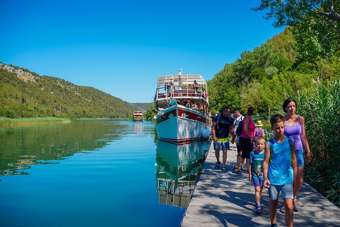 From Split: Krka Waterfalls Trip with Boat Cruise and Swimming - Primošten beach break, plus the lunch reality check