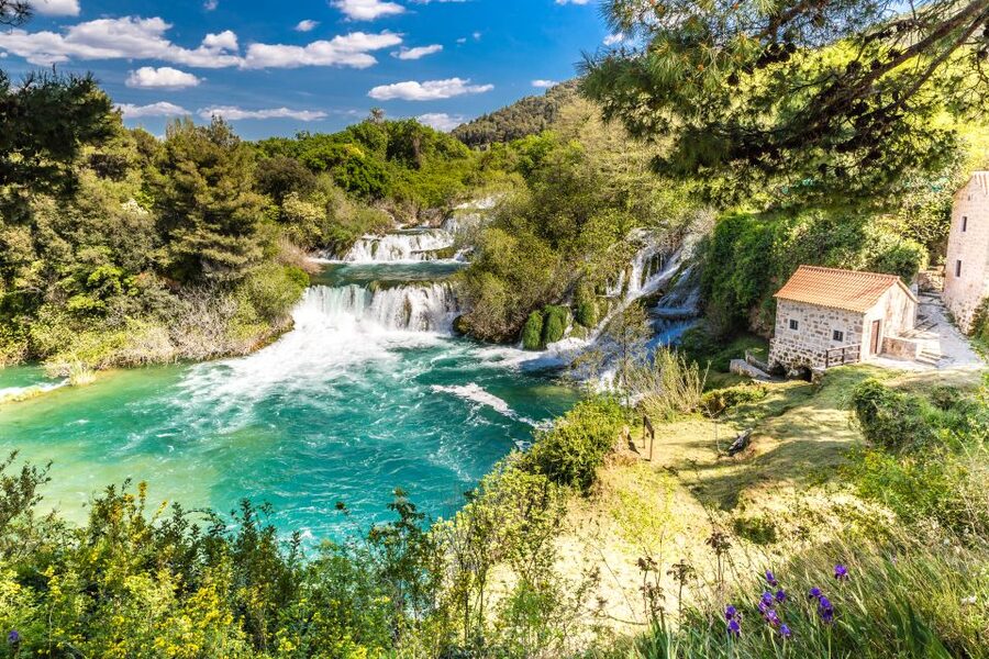 From Split & Trogir: Krka Waterfalls Day Tour with Boat Ride - The park village stops: stone houses, workshops, and a watermill
