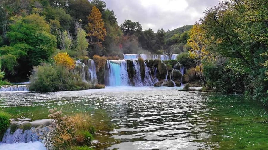 From Trogir, Seget & Okrug: Krka Waterfalls Culture Tour - The Smart Mix: Waterfalls, UNESCO, and a Sea-Stop Day