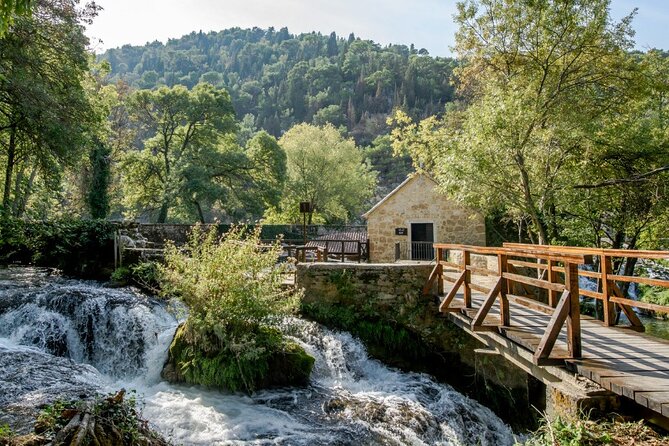 Krka Waterfalls tour with Trogir Walking tour and Krka panoramic boat cruise - Skradinski Buk in Krka National Park: boardwalks, pine shade, and the main waterfall area