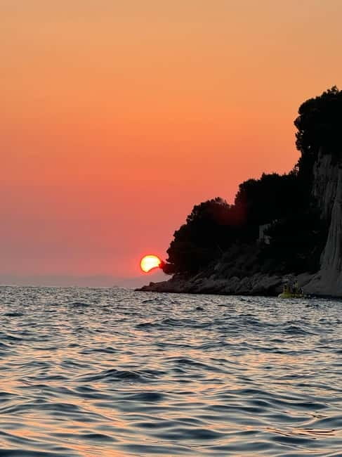 Makarska: Sunset private boat tour from Makarska - The mid-sea sunset photo moment in front of Makarska