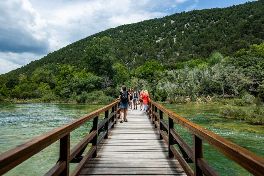 Split: Krka National Park Day Trip with Boat Ride & Swimming - Ethno village, stone houses, and old watermills: what the cultural stop adds