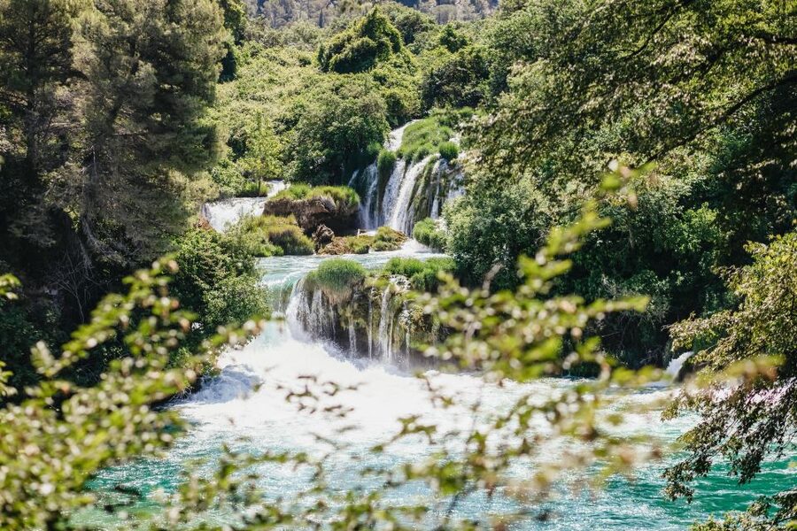 Split: Krka Waterfalls Trip with Boat Cruise and Swimming - Skradin river cruise: the calm lead-in to Skradinski Buk