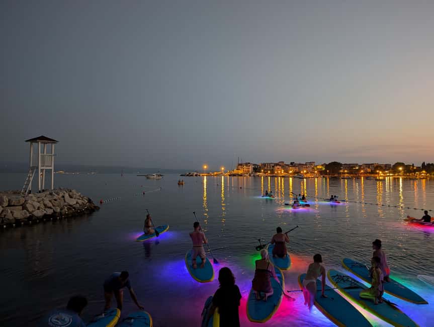 Split: Stand Up Paddleboard Night Glow Tour - Stobreč scenery, traditional houses on cliffs, and an open-sea option
