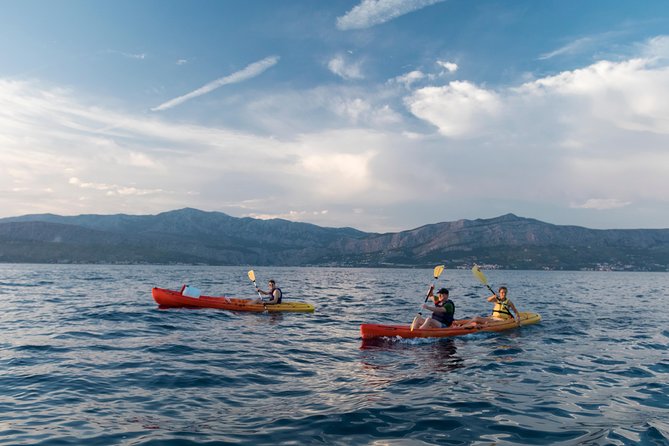 Sunset Kayaking - Paddling west toward sunset: Pines, olives, bays, and rocky edges