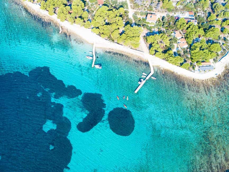 Trogir: Blue Lagoon, Maslinica, and Solinska Bay Boat Tour - Maslinica village time: castle views and a real place to walk